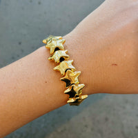 Gold bracelets with black adjustable cord
